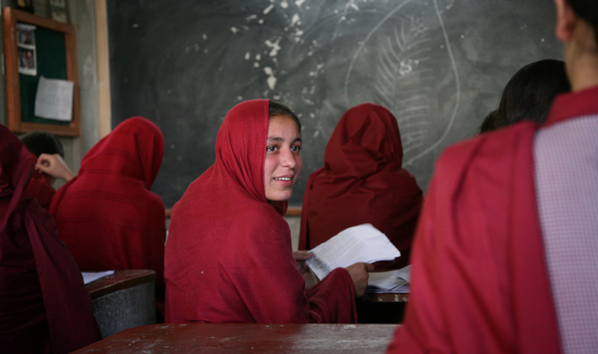 Girls from a school supported by Hashoo Foundation sit in their classroom.