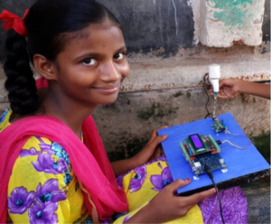 A young girl in Bawana, India built a water quality monitoring device in a tinkering lab that allows her community to check their water supply to ensure it is safe to drink. (Photo by Intel)
